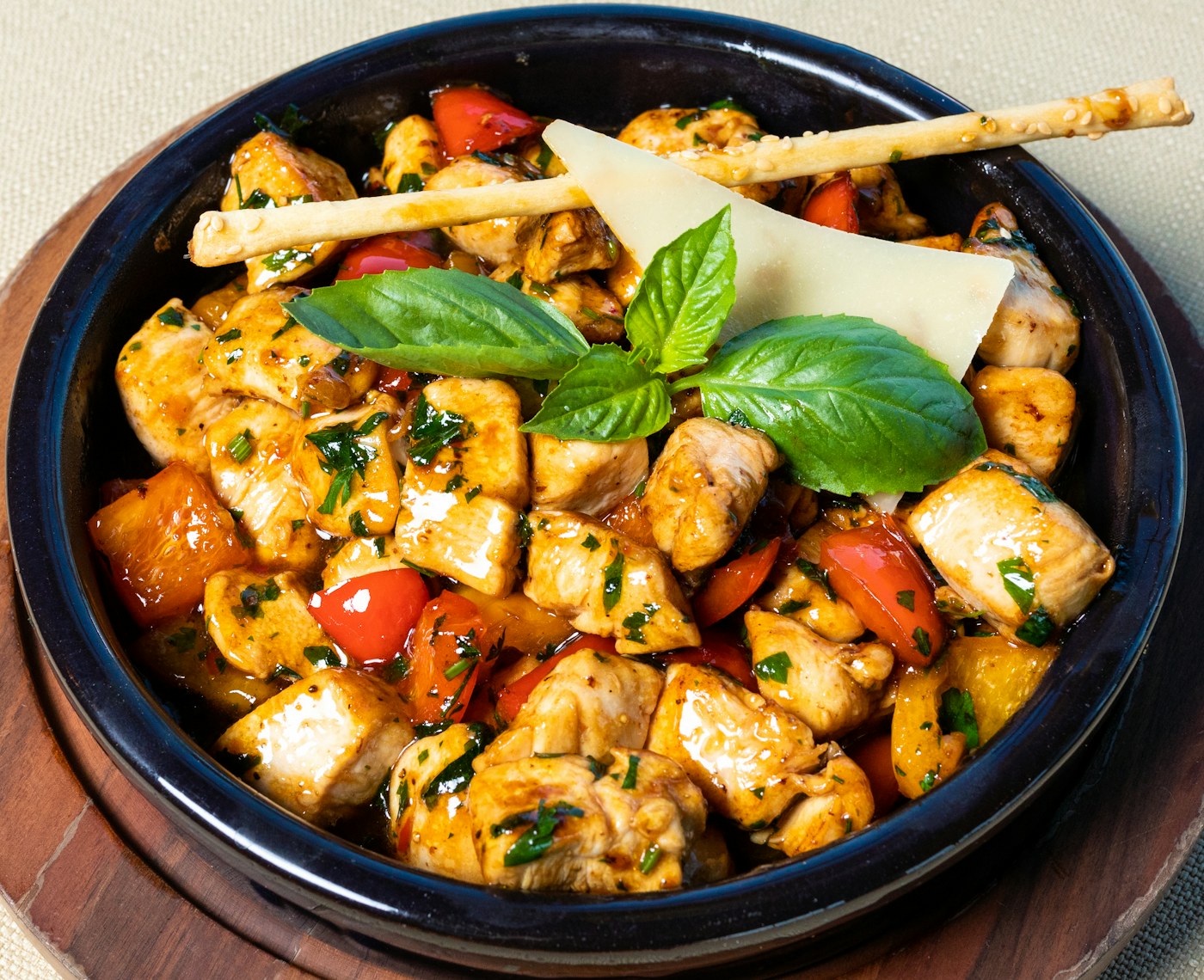 A hearty, freshly cooked meal of seasoned chicken, peppers and tomatoes, ready to be portioned for the freezer